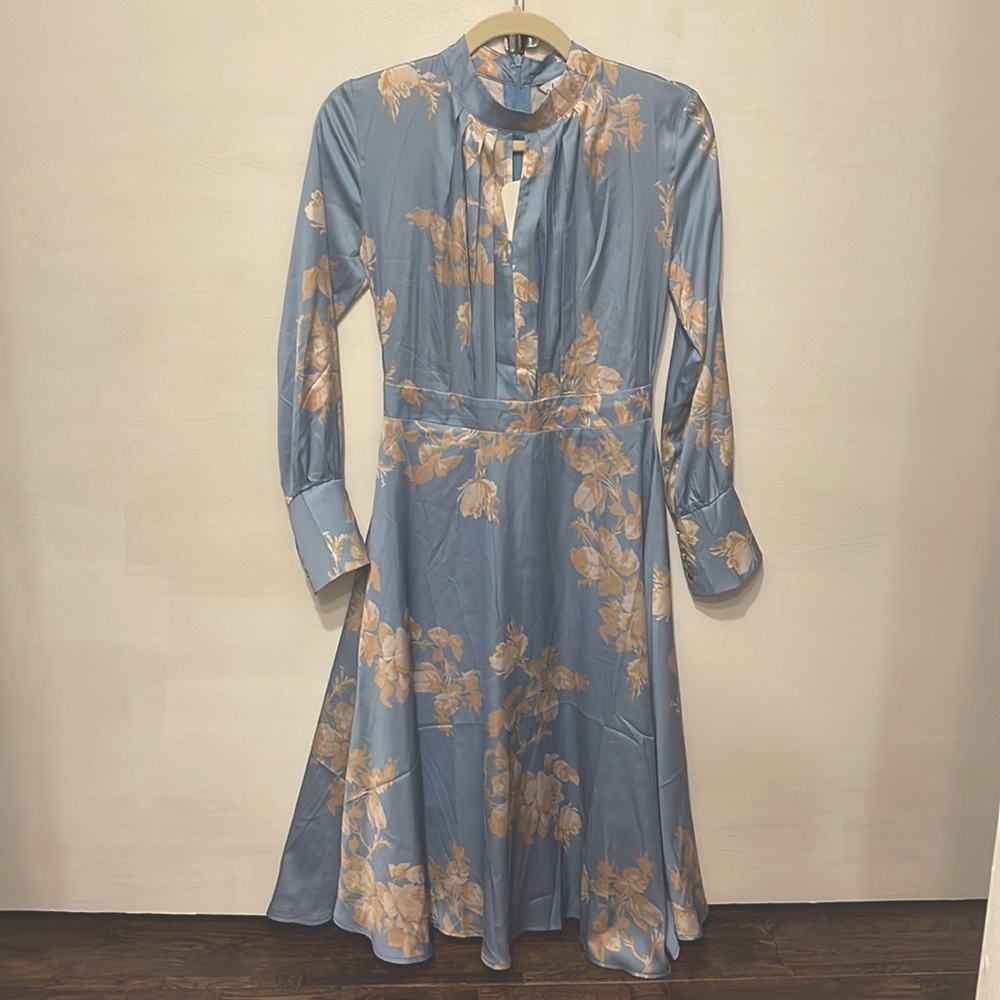 NWT Light blue and beige/white florals. Long sleeves.